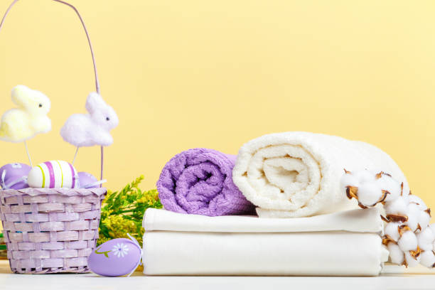 istock Towel rolls white bed linen with Easter decor on the table.Still life space 1454198681