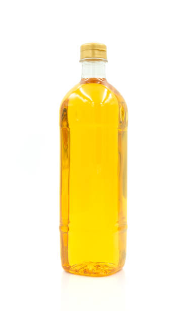istock Vegetable oil cooking in plastic clear bottle with lid isolated on white background. 1454199797