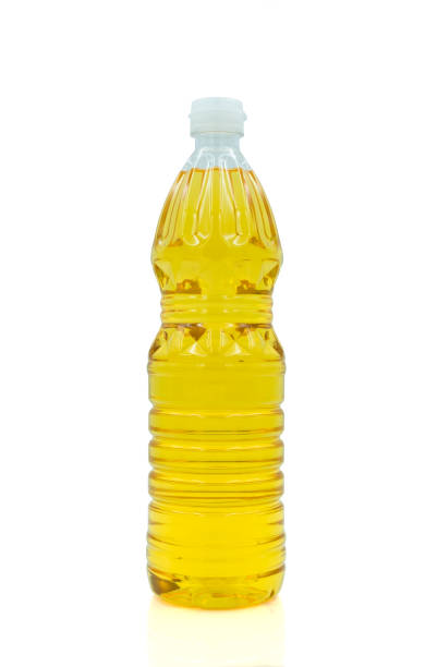 istock Vegetable oil cooking in plastic clear bottle with lid isolated on white background. 1454199837
