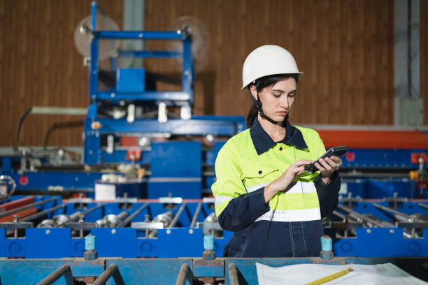 istock Portrait engineer woman use calculator and paper work working with machine background at metal sheet factory 1454200583