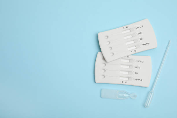 istock Disposable express hepatitis test kit on light blue background, flat lay. Space for text 1454205368