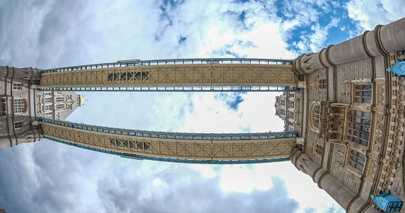 London, United Kingdom – July 01, 2022: A low angle view of the Tower Bridge in London connecting two medieval castles