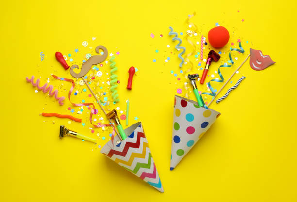 istock Beautiful flat lay composition with festive items on yellow background. Surprise party concept 1454205489