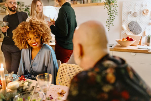 istock Cozy New year dinner among friends 1454205513