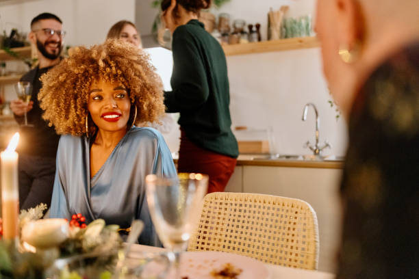 istock Group of friends chatting during dinner party 1454205514