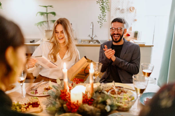 istock Friends exchanging Christmas presents 1454205670