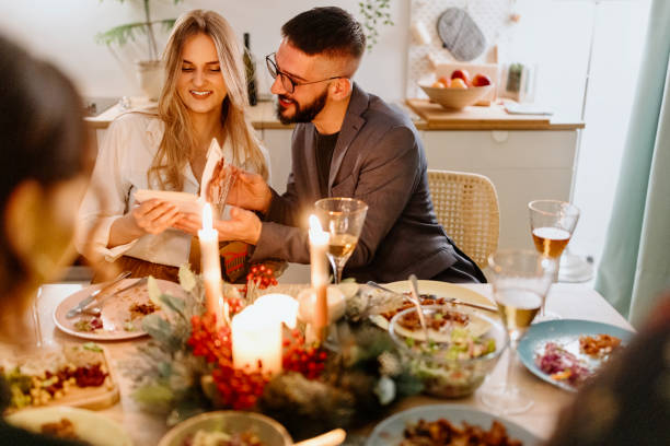istock Friends exchanging Christmas presents 1454205707