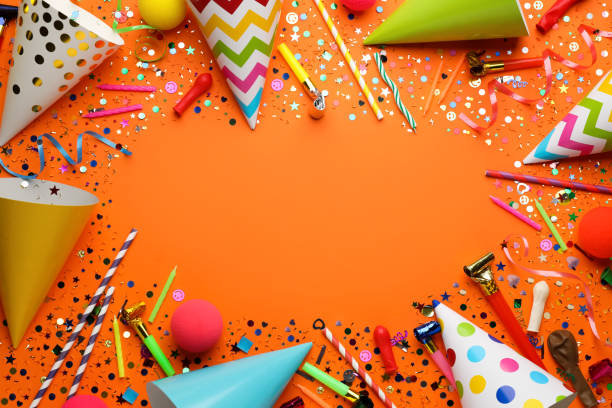 istock Frame of festive items on orange background, flat lay with space for text. Surprise party concept 1454206565