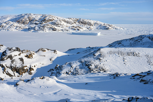 View over the frozen Tasiilaq Fjord, located in East Greenland.