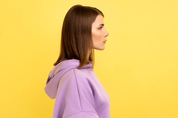 istock Serious unsmiling strict woman looking at camera with calm attentive focused expression. 1454208205