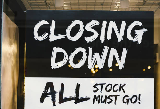 istock Closing down sale sign in store window 1454211855
