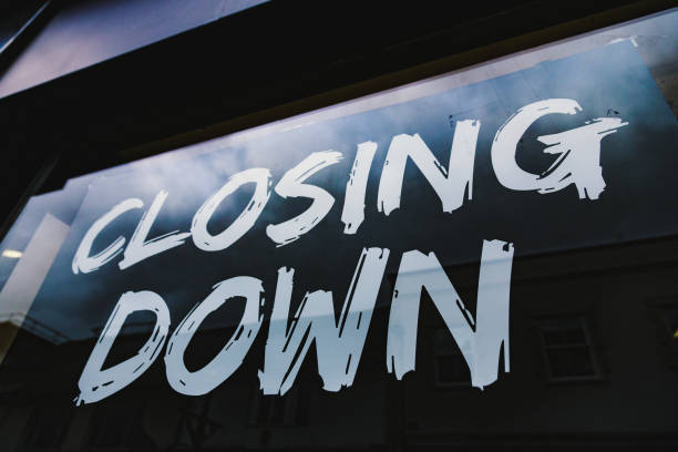 istock Closing down sale sign in store window 1454211890