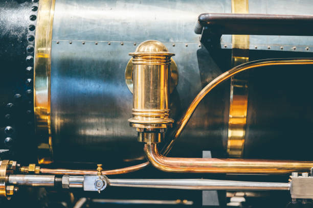 istock Shiny golden train whistle on a black train 1454212932