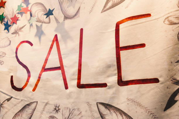 istock Sale sign in store window 1454213109