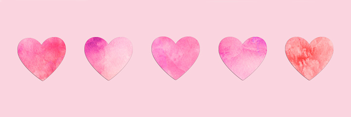 Paper hearts aligned on pink panoramic background, minimal Valentines day web banner