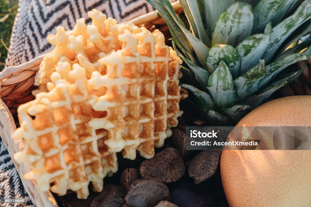 Waffles and fruit in a basket Breakfast outdoors Basket Stock Photo
