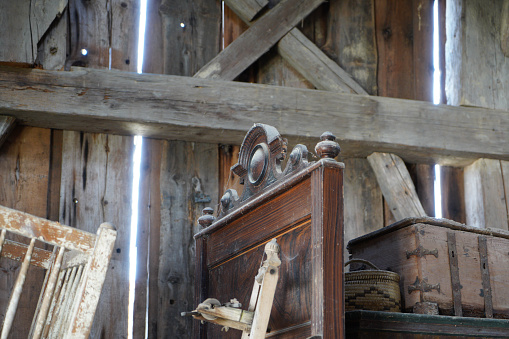 Old depository room with wooden portal in old country house in Italy