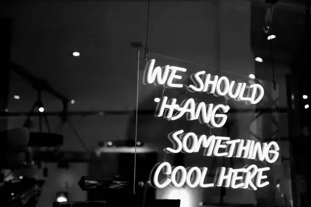 Photo of Neon sign saying we should hang something cool here