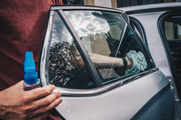 istock Young man cleans his electric vehicle 1454216633