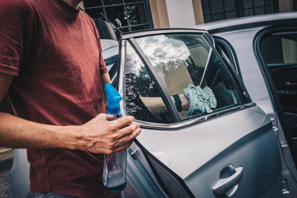 istock Young man cleans his electric vehicle 1454216648