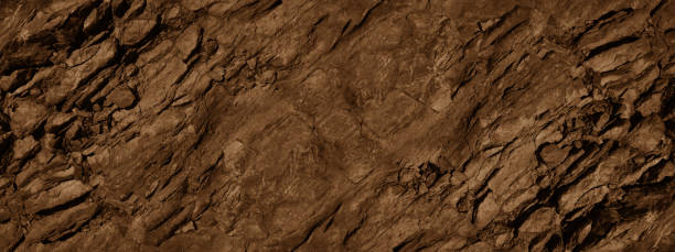 istock Red brown stone background with space for design. rock surface texture. Cracked, crumbled, crushed. 1454218703
