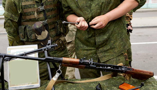 istock The soldiers are considering Russian made weapons. 1454219163