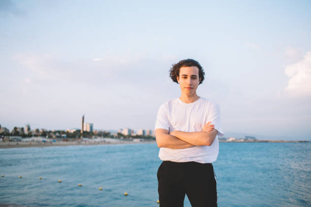 istock Joyful male looking at camera against seascape 1454223028