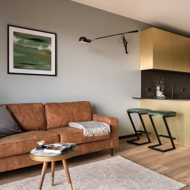 istock Brown sofa in living room open to kitchen 1454223314