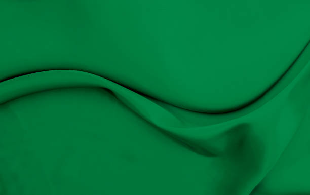 istock Black green satin dark fabric texture luxurious shiny that is abstract silk cloth background with patterns soft waves blur beautiful. 1454225741