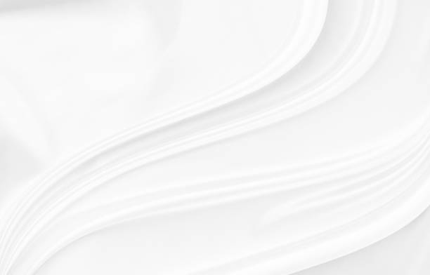 istock White gray satin texture that is white silver fabric silk background with beautiful soft blur pattern natural. 1454225856