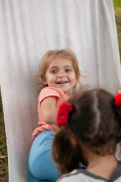 istock Little girl having fun on the hammock 1454226259