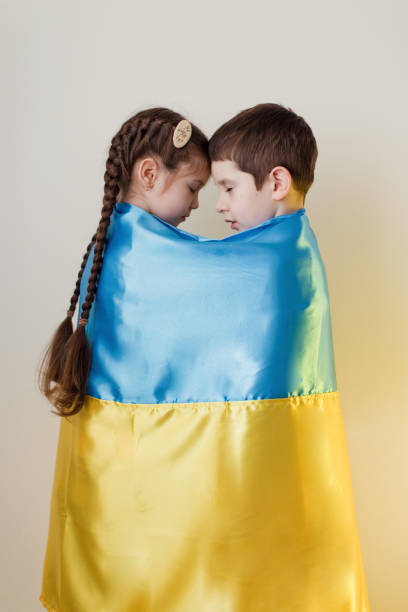 istock Boy and girl with flag Ukraine. 1454227159