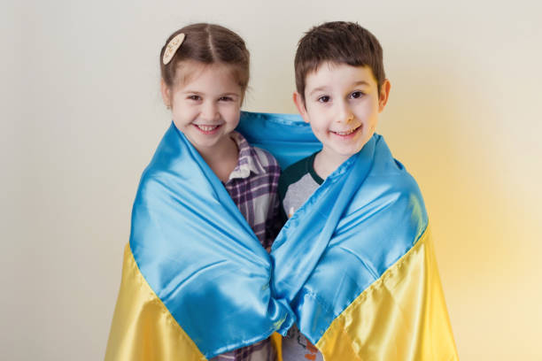 istock Boy and girl with flag Ukraine. 1454227160