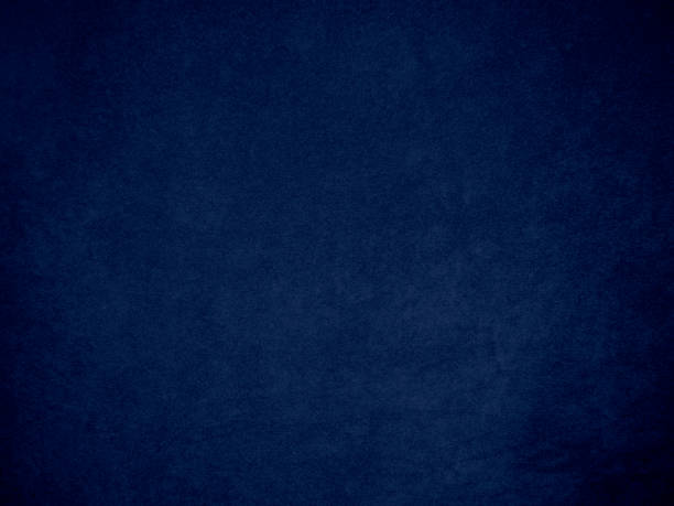 istock Dark blue velvet fabric texture used as background. Tone color blue cloth  background of soft and smooth textile material. There is space for text and for all types of design work. 1454228423