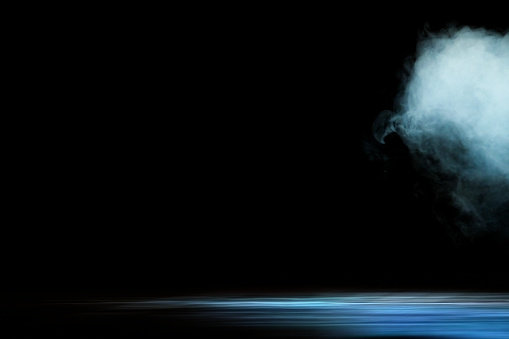 Dry white ice smoke clouds fog empty stage textured. Isolated black background