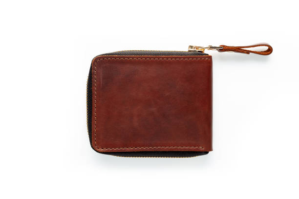 istock Brown leather wallet with zipper isolated on white background. Top view 1454232689