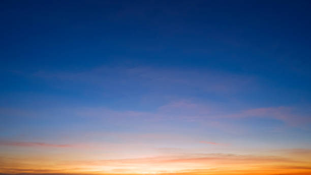 istock Dusk sky background with beautiful sunlight and sunset cloud after sundown on blue Twilight sky 1454232922