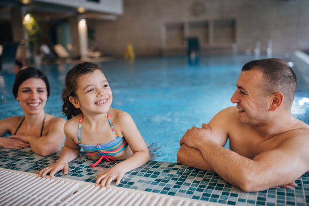 istock Family in hotel pool 1454233026