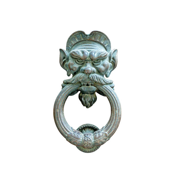 istock Ancient lion head doorknob isolated 1454233165