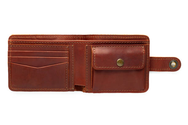 istock Brown leather wallet on a button on a white background. Top open view 1454233324