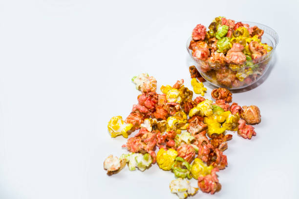 istock Popcorn poured out of the cup on a white background. 1454233352