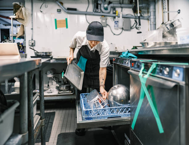 istock Young Korean female chef working in restaurant kitchen 1454234180