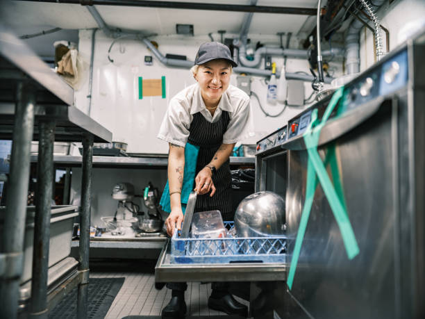 istock Young Korean female chef working in restaurant kitchen 1454234202