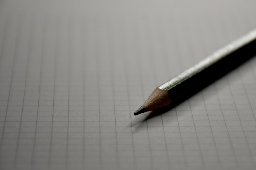 Close-up of a pen on the empty notebook page