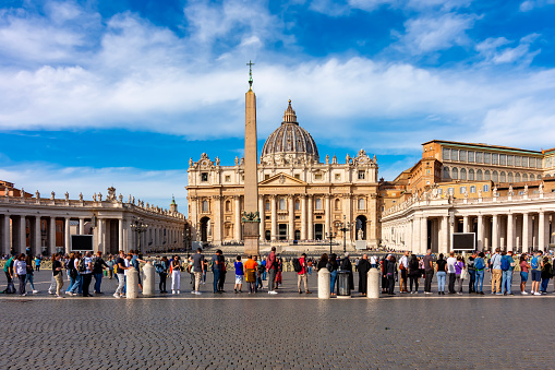 Vatican - October 2022: People standing in line to visit St. Peter's Basilica on St. Peter's square, center of Rome, Italy