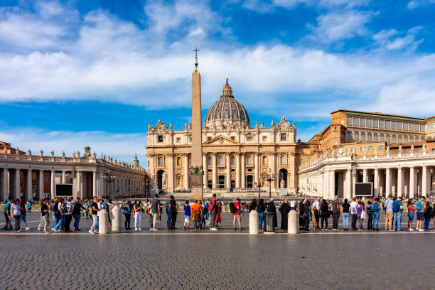 People standing in line to visit St. Peter's Basilica on St. Peter's square in Vatican, center of Rome, Italy stock photo