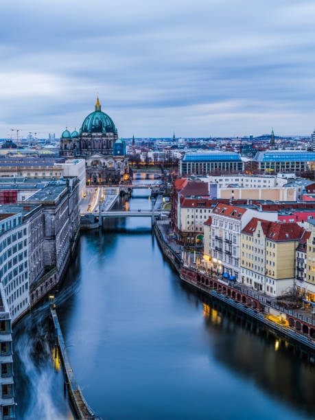 istock Berlin city  buildings on spree canal after sunset 1454246162