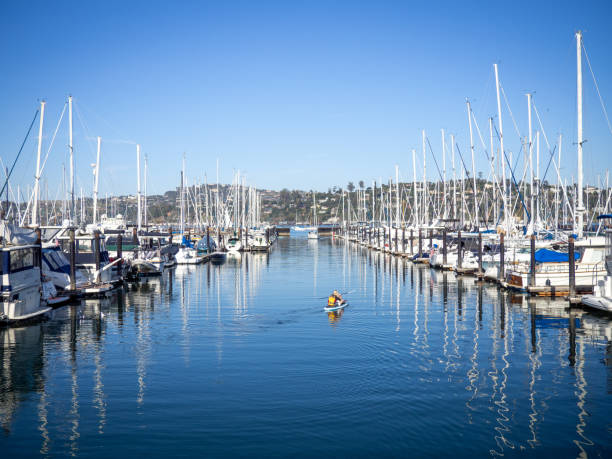 Sausalito Marina Mother and son paddle boarding in the marina in Sausalito, California sausalito stock pictures, royalty-free photos & images