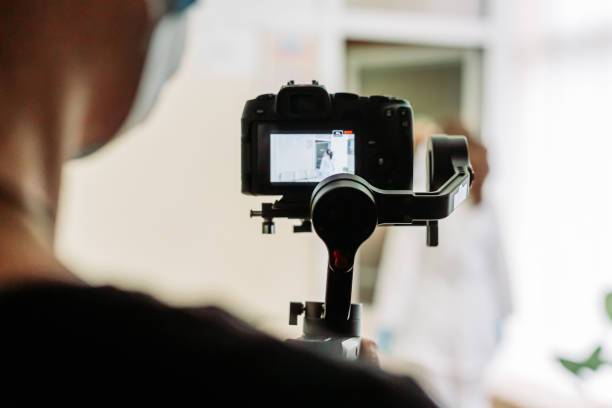 istock Videographer recording video on the site with mirrorless camera using gimbal 1454252068