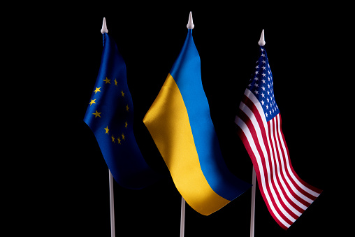 The flag of Ukraine of the United States and Europe on a black background. The concept of support for Ukraine in difficult times. Relations between countries.